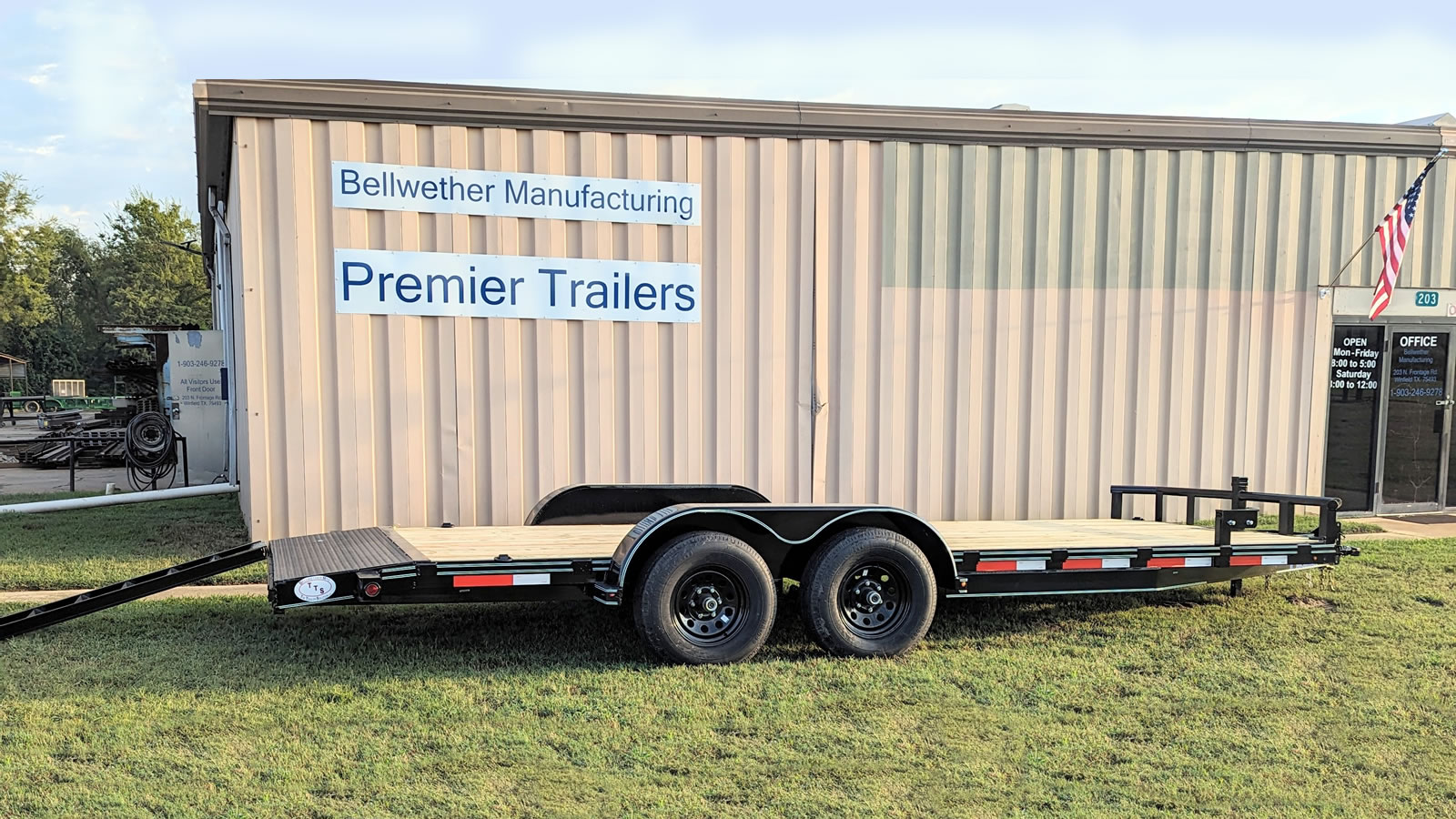 Car hauler trailer with wood floor and metal ramps